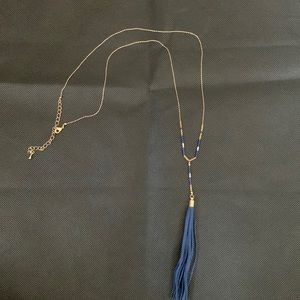 Fine gold chain with beading detail and suede tassel